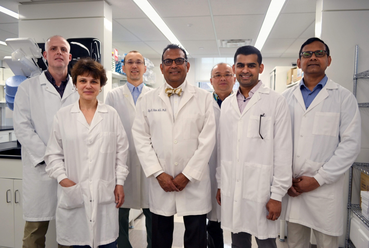 Dr. Rajiv Ratan, center, and his research team at the Burke Neurological Institute