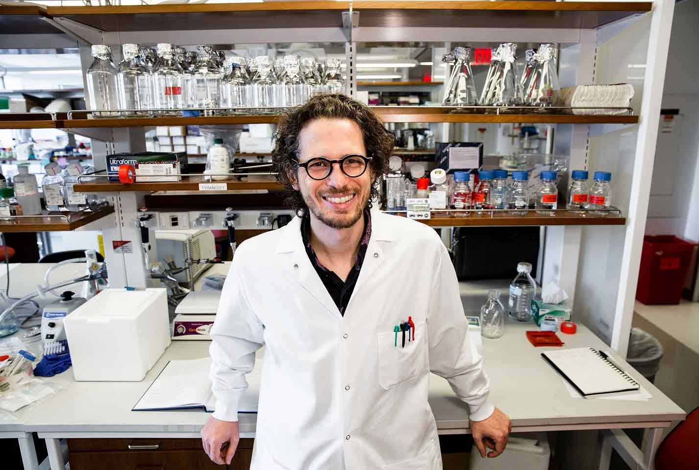 Dr. Landau standing in lab
