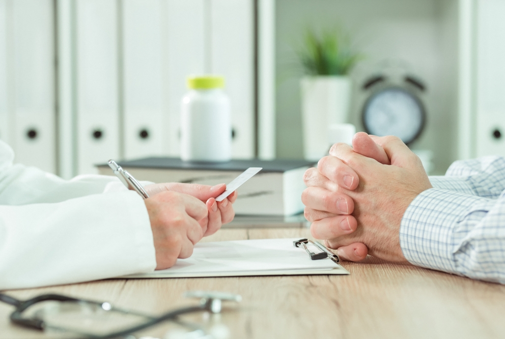 image of a doctor and patient discussing medical insurance