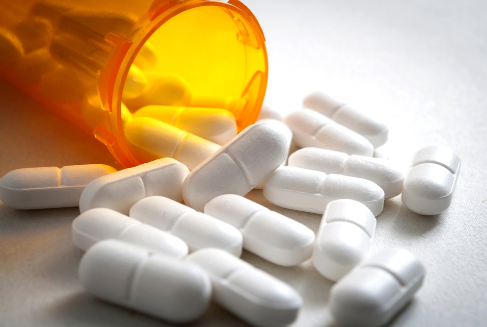 Pills spilling out of a bottle
