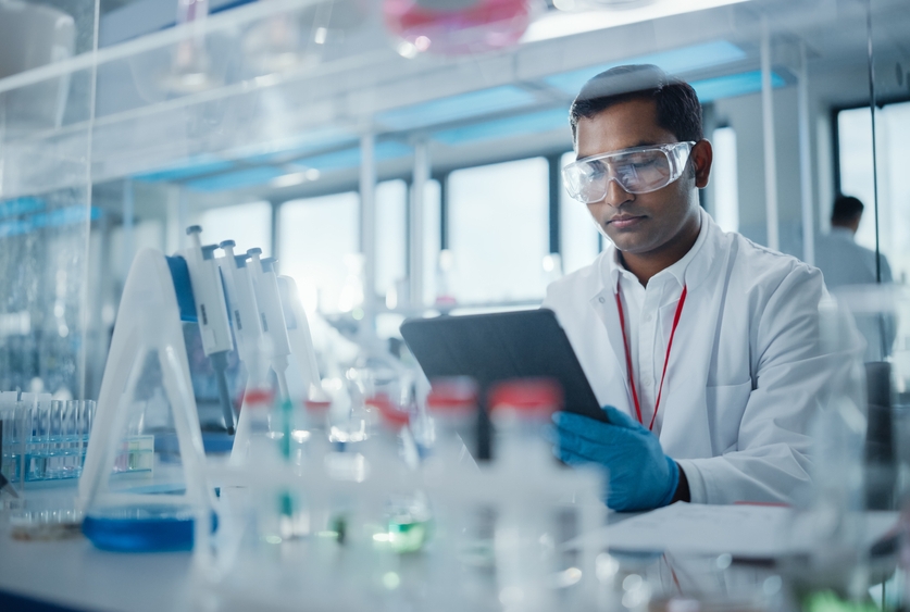 a man in a lab with goggles on