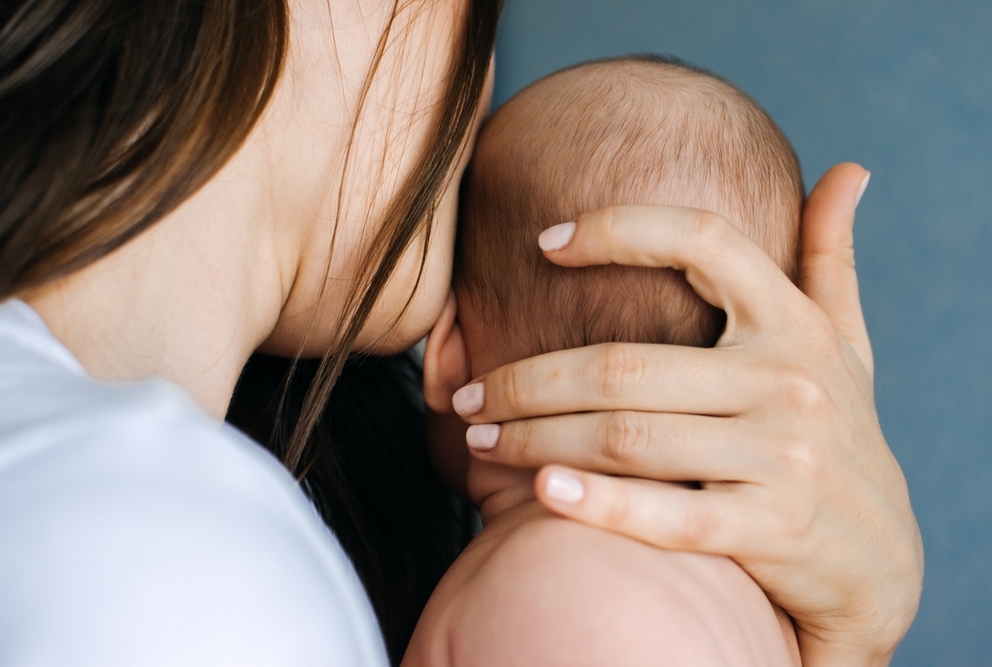 a woman holding her baby