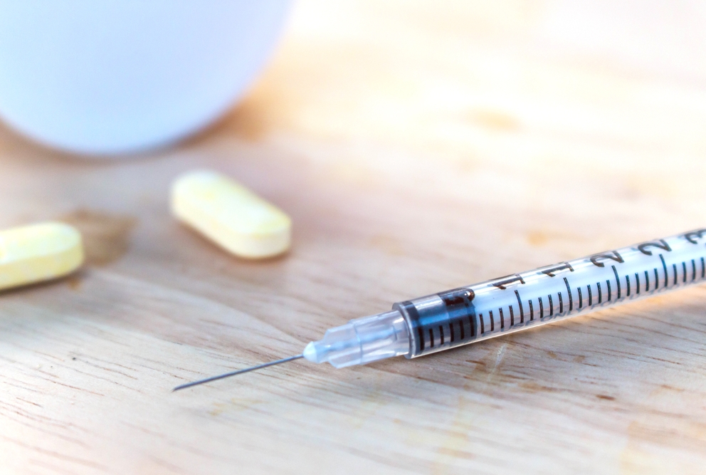 pills and needle