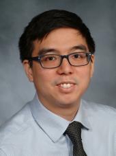 man in glasses smiling