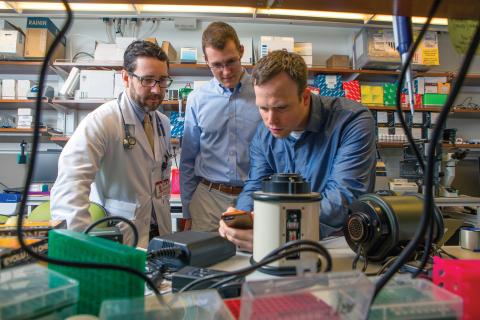 Eugene Carragee ’18 (left) and Tom Donahoe ’19 with mentor Dr. Chris Mason(right)