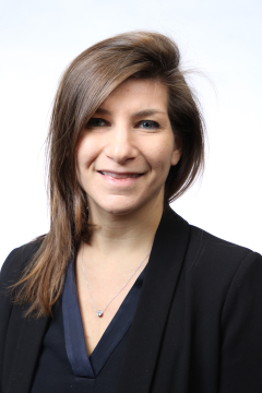 a woman smiling for a portrait