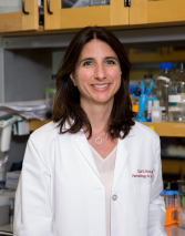 a woman in a lab posing for a picture