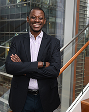 man standing in front of a staircase