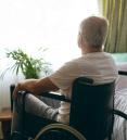 Elderly man sitting in nursing home during quarantine