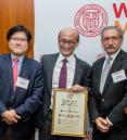 Dean Augustine M.K. Choi and Dr. Stuart Mushlin pose with Dr. Thomas Lee as he holds his award