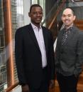Dr. Lishomwa Ndhlovu and Dr. Michael Corley standing in the Belfer Research Building